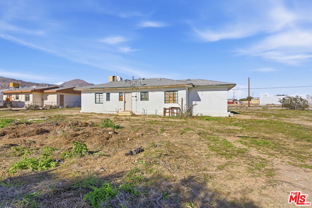 13879 Carson Street Trona, CA 93562 - Photo 25 of 29 a front view of a house with a garden