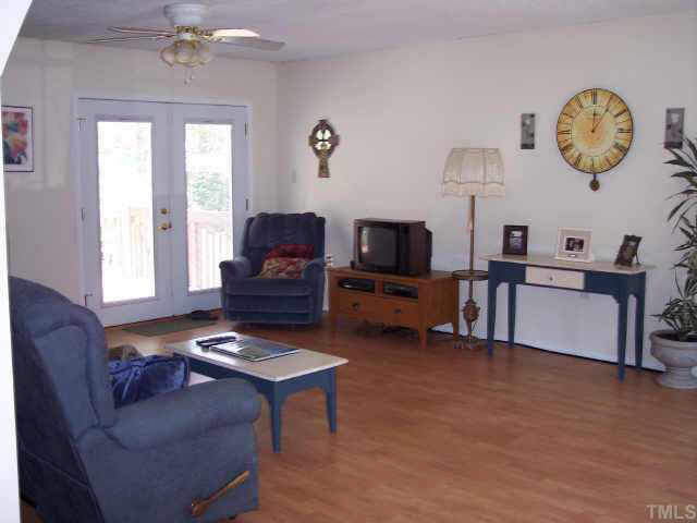740 Capps Road Selma, NC 27576 - Photo 3 of 7 Huge living room that opens up to back deck. Perfect for entertaining.