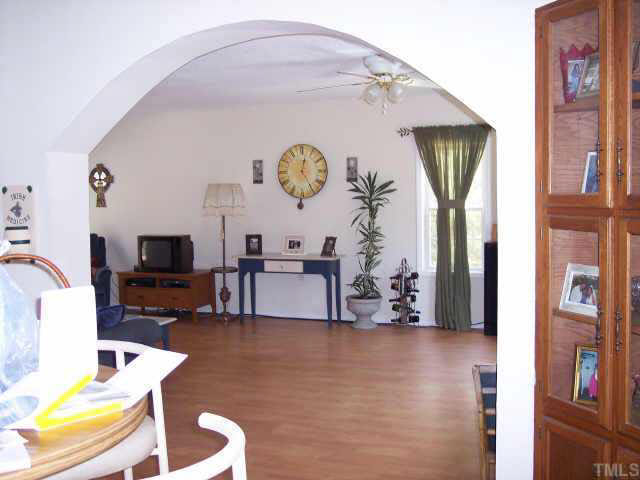 740 Capps Road Selma, NC 27576 - Photo 4 of 7 Arched doorway from dining/kitchen to living room.