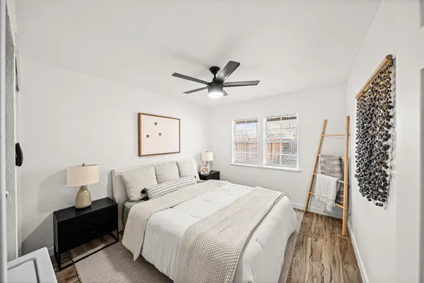 a bedroom with a bed and a window