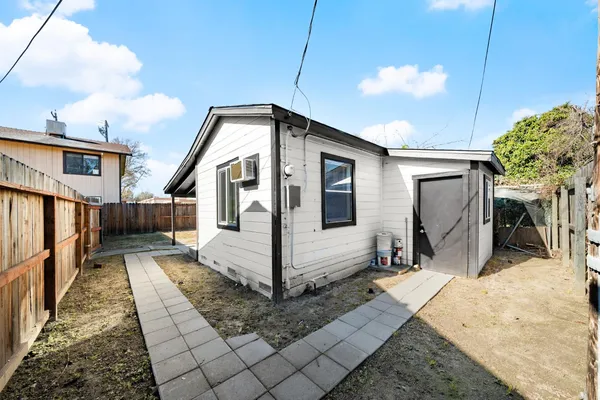 an aerial view of house with a yard