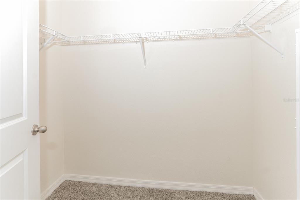 13628 Covey Run Place Spring Hill, FL 34609 - Photo 13 of 22 a view of small space with racks on the wall