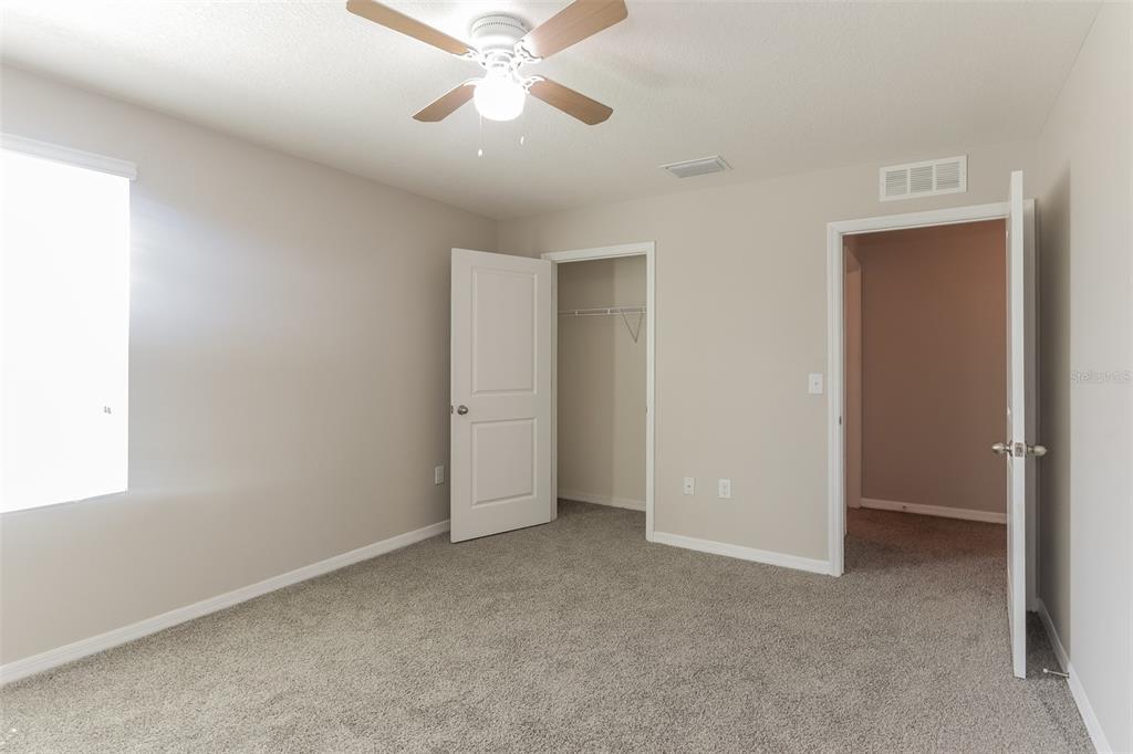 13628 Covey Run Place Spring Hill, FL 34609 - Photo 16 of 22 wooden floor in an empty room