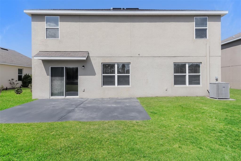 13628 Covey Run Place Spring Hill, FL 34609 - Photo 20 of 22 a view of backyard of house