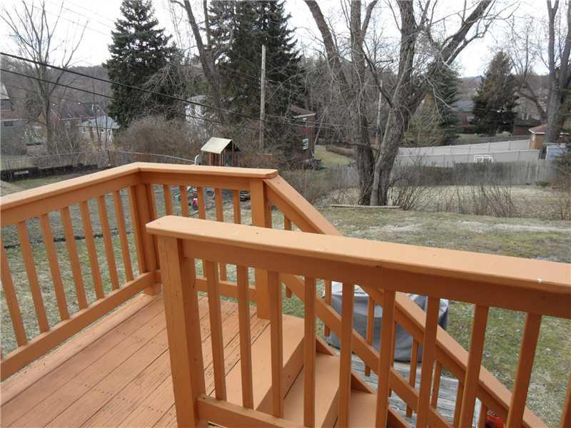 5227 Verona Road Verona, PA 15147 - Photo 20 of 24 Patio/Deck. The kitchen opens to the back yard and a newly sealed and painted deck and stairs.