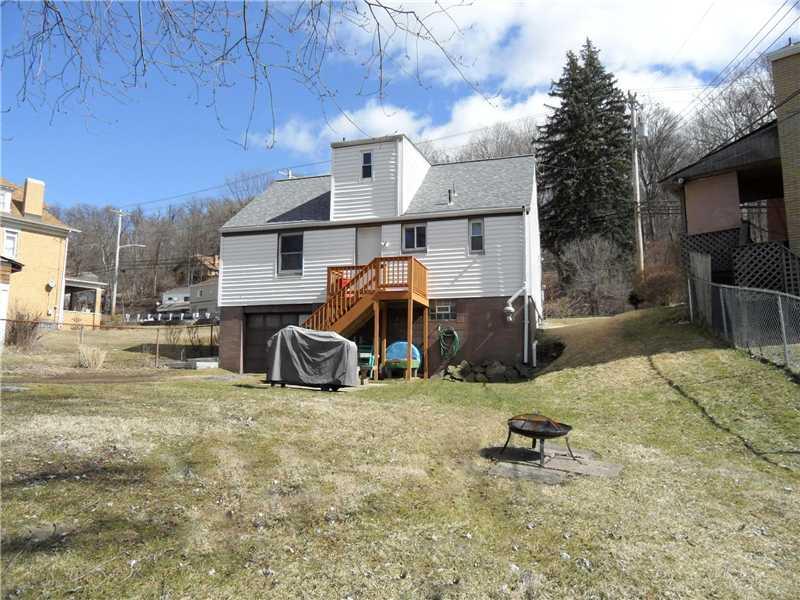 5227 Verona Road Verona, PA 15147 - Photo 22 of 24 Exterior Back. Mostly level back yard with space for grilling, picnic table, and a fire pit, swing set and more.