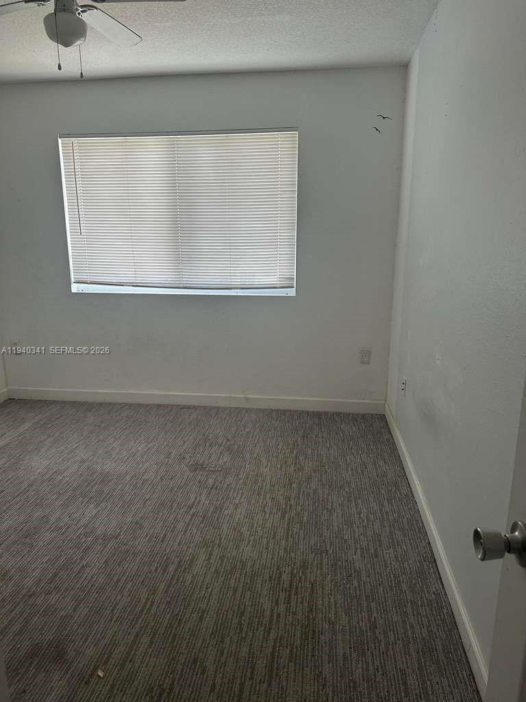 15460 Southwest 284th Street, Unit 4301 Homestead, FL 33033 - Photo 14 of 17 an empty room with a window