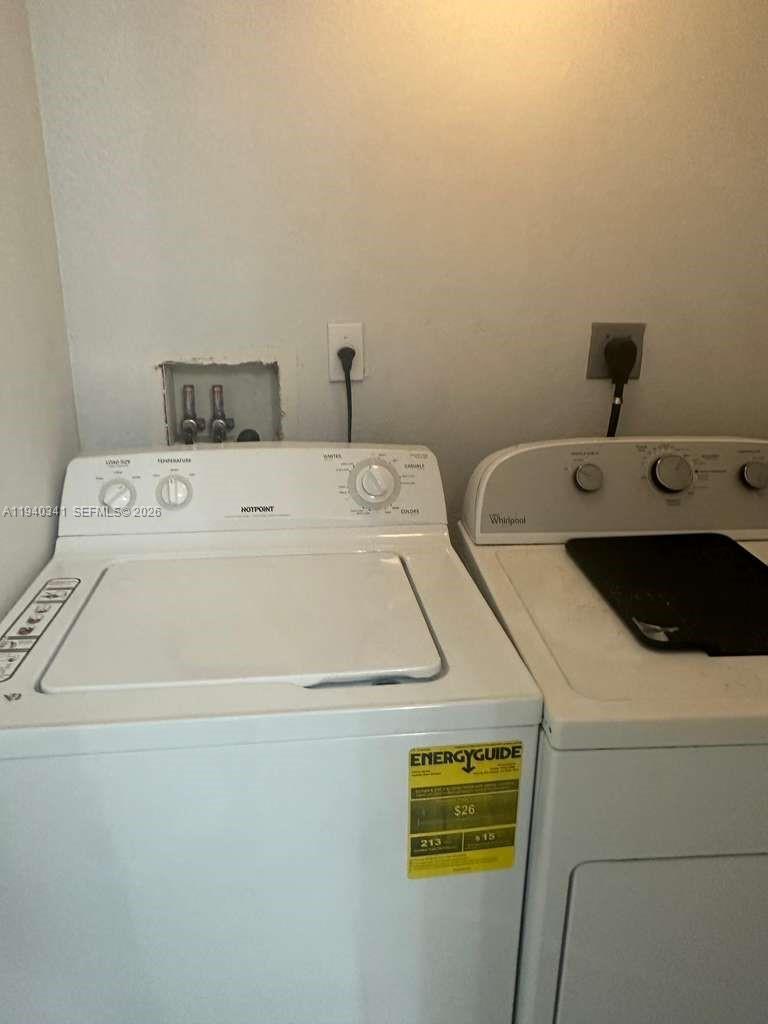 15460 Southwest 284th Street, Unit 4301 Homestead, FL 33033 - Photo 16 of 17 a utility room with dryer and washer