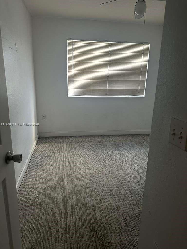 15460 Southwest 284th Street, Unit 4301 Homestead, FL 33033 - Photo 17 of 17 an empty room with a window