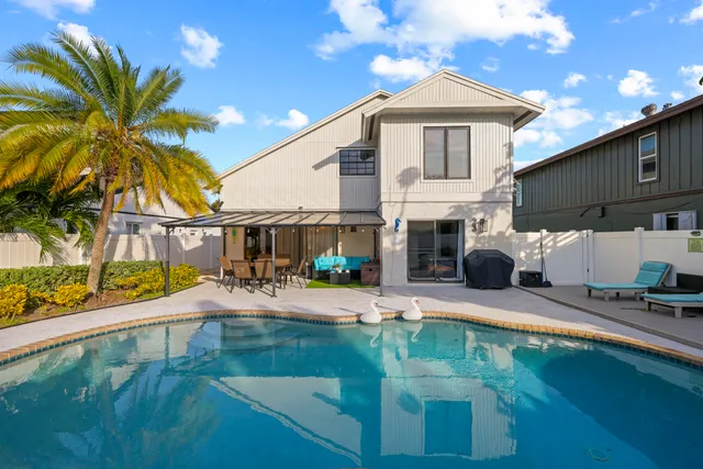 a view of a patio with swimming pool