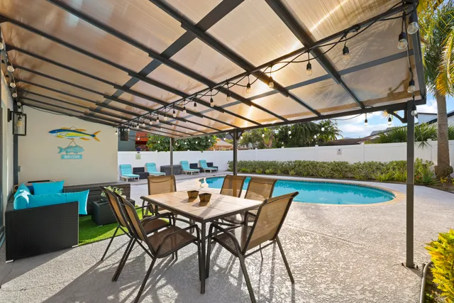 a view of a swimming pool with sitting area