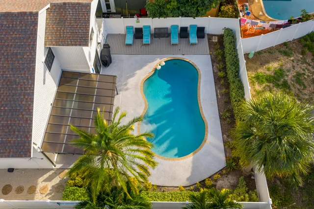 an aerial view of residential houses with outdoor space