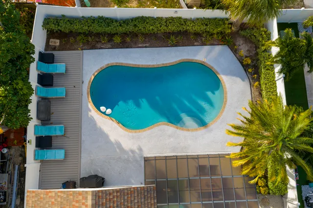 an aerial view of residential houses with outdoor space