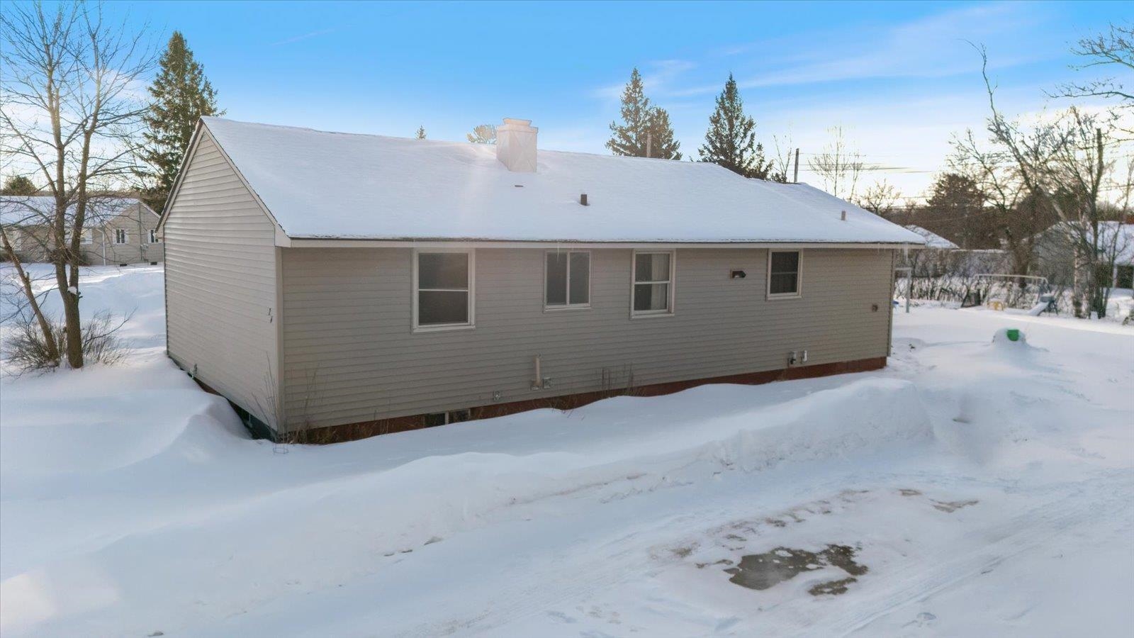 24 Fern Court Babbitt, MN 55706 - Photo 13 of 41 Snow covered house with a chimney