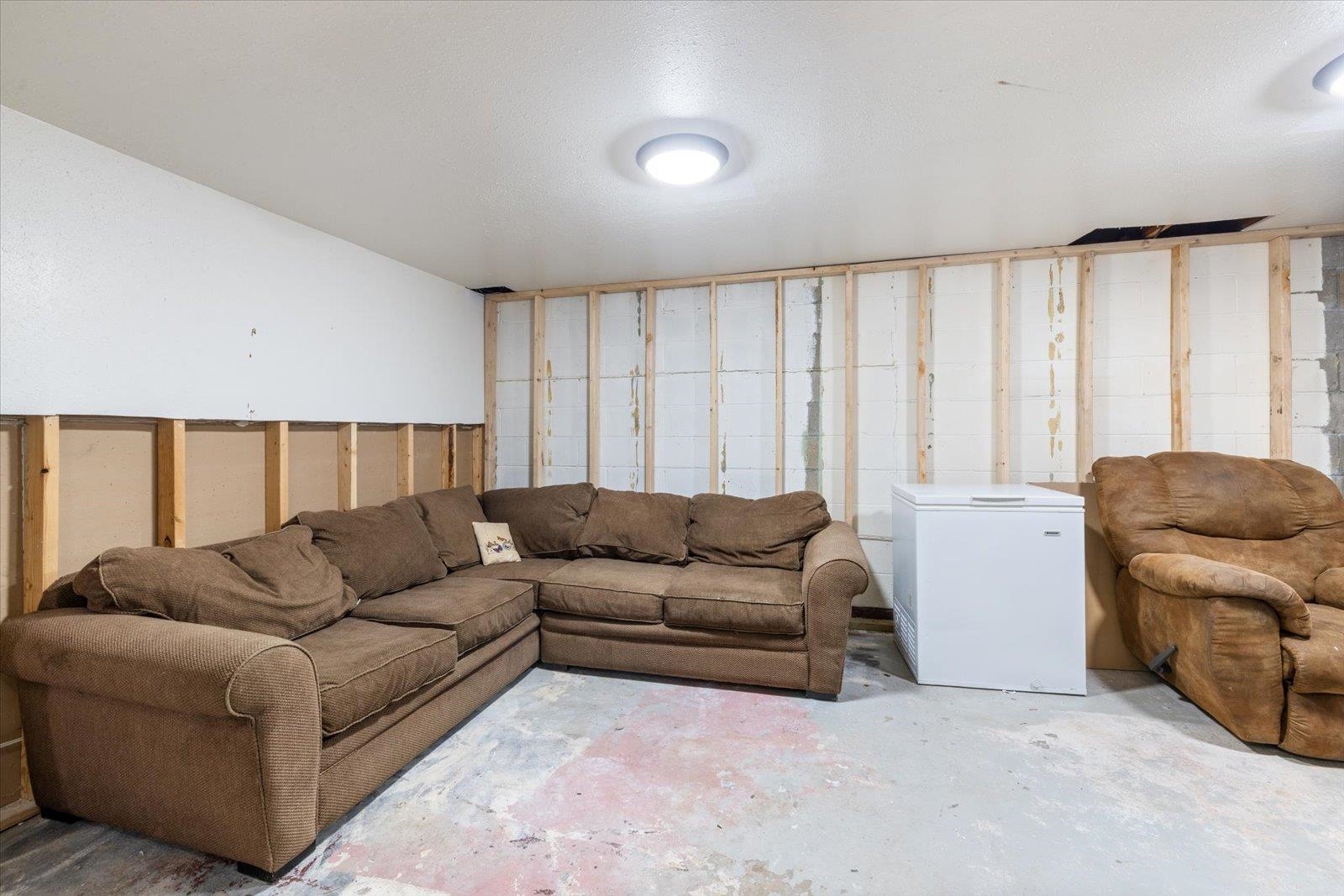 24 Fern Court Babbitt, MN 55706 - Photo 29 of 41 Living room featuring unfinished concrete floors