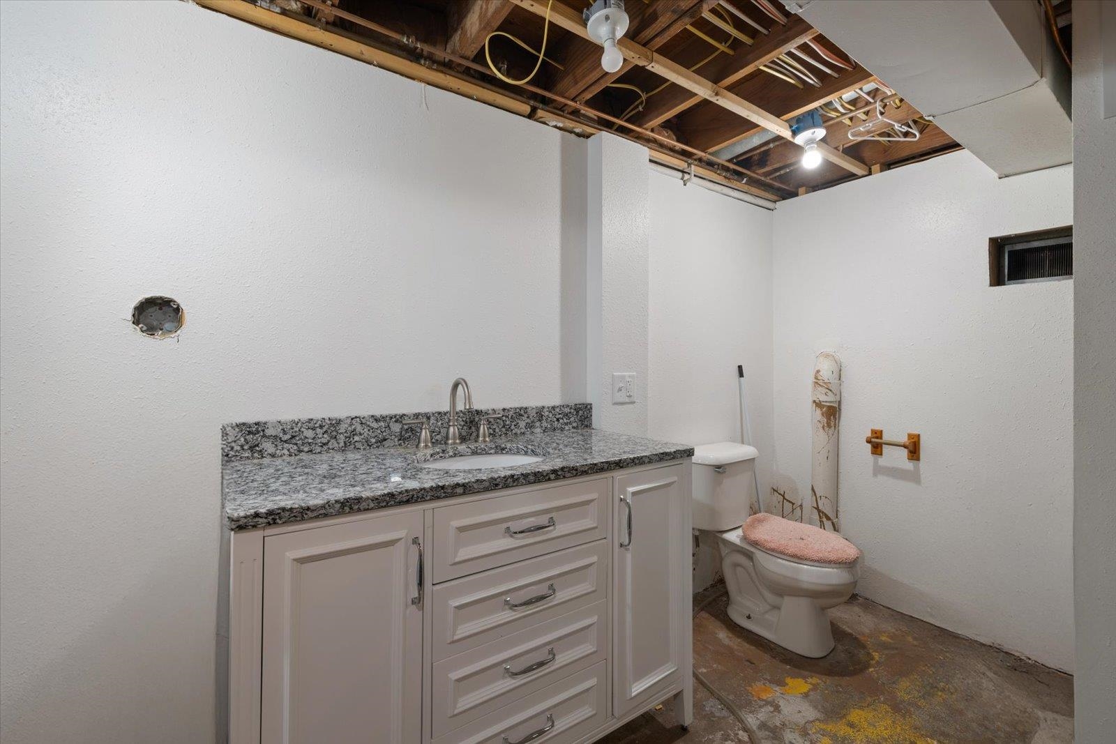 24 Fern Court Babbitt, MN 55706 - Photo 32 of 41 Half bath with vanity and toilet