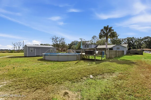 a view of a house with a big yard