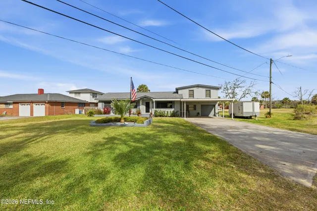 a view of a backyard with a patio