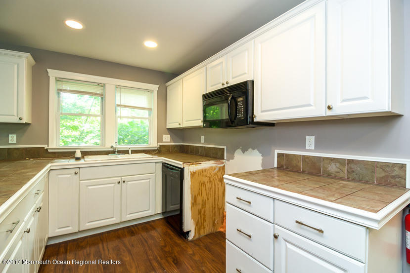 799 Leonardville Road Leonardo, NJ 07737 - Photo 11 of 25 a kitchen with a sink stove and microwave