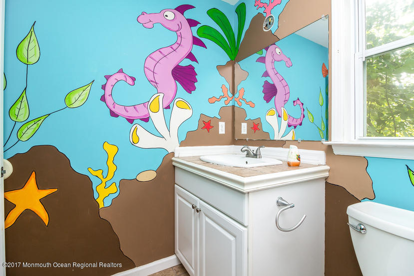 799 Leonardville Road Leonardo, NJ 07737 - Photo 19 of 25 a bathroom with a sink mirror and vanity