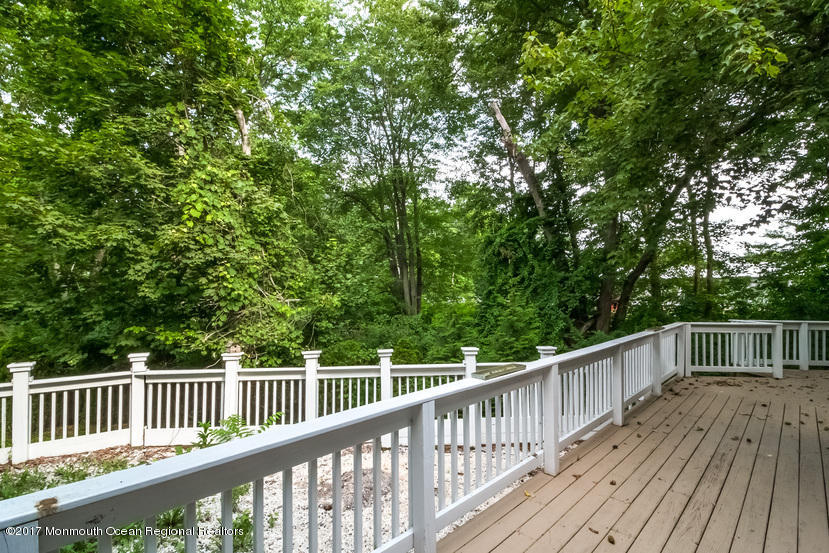 799 Leonardville Road Leonardo, NJ 07737 - Photo 21 of 25 a view of deck and a yard with wooden fence