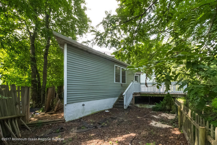 799 Leonardville Road Leonardo, NJ 07737 - Photo 23 of 25 a view of a house with a backyard and a tree