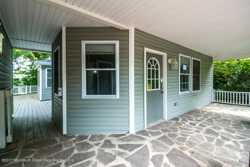 799 Leonardville Road Leonardo, NJ 07737 - Photo 25 of 25 a view of a brick house with a large window