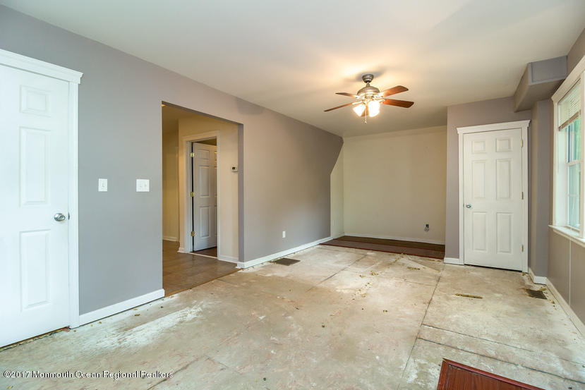 799 Leonardville Road Leonardo, NJ 07737 - Photo 4 of 25 an empty room with closet and a chandelier fan