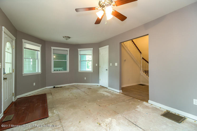 799 Leonardville Road Leonardo, NJ 07737 - Photo 5 of 25 a view of an empty room with window and chandelier fan
