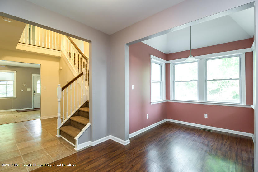 799 Leonardville Road Leonardo, NJ 07737 - Photo 7 of 25 an empty room with wooden floor and windows