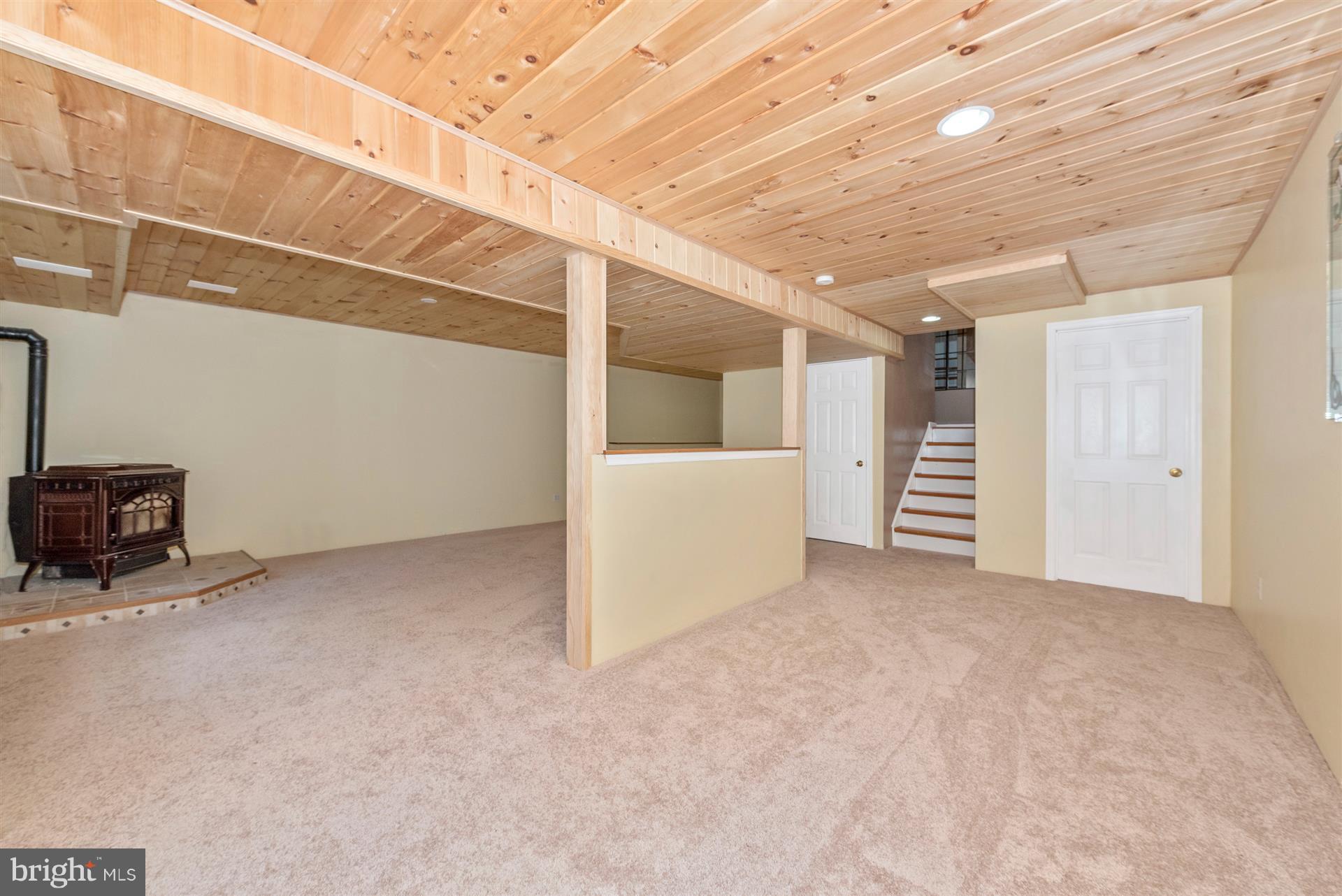 11217 Coppermine Road Woodsboro, MD 21798 - Photo 21 of 30 Finished Basement With Half Bath and Pellet Stove