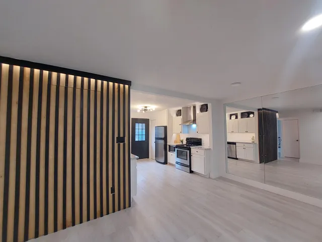 a view of a livingroom with furniture and furniture