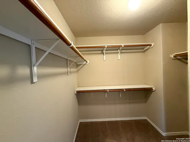 a bathroom with a sink a large mirror and a bathtub