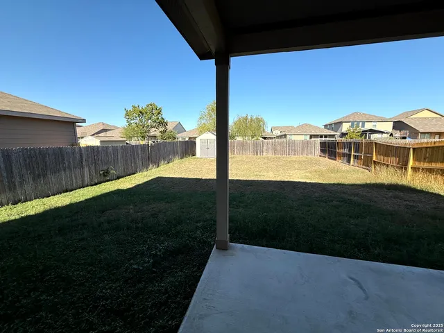 a view of a yard with an outdoor space