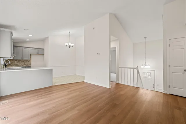 a view of a kitchen with wooden floor