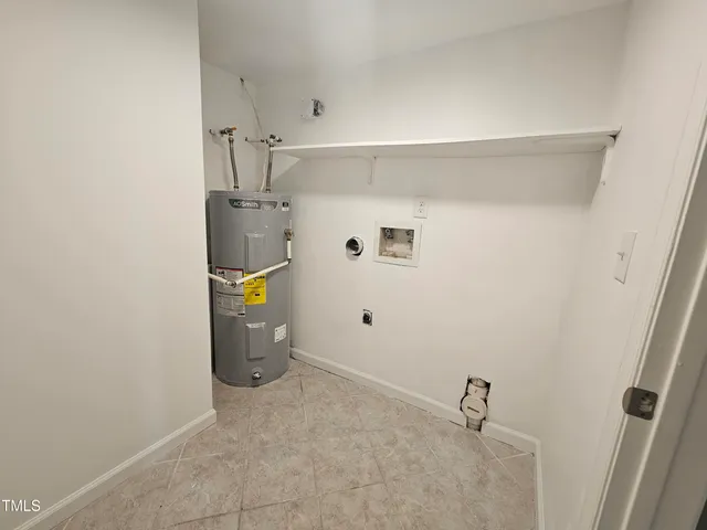 a view of storage and utility room with utility room
