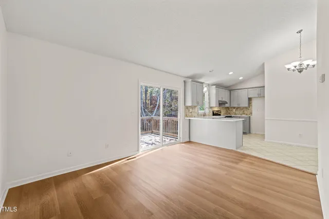 a view of kitchen with wooden floor