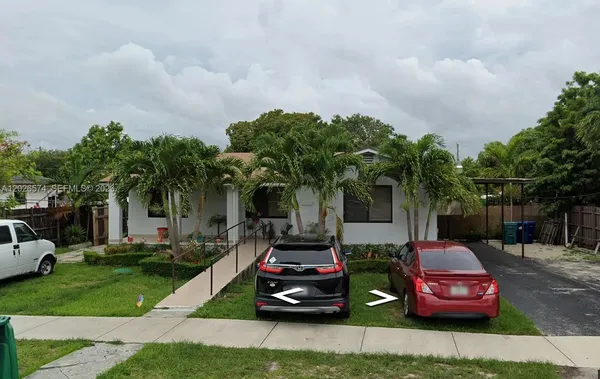 a car parked in front of a house