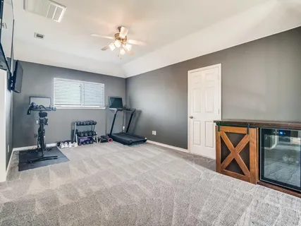 a view of a room with gym equipment
