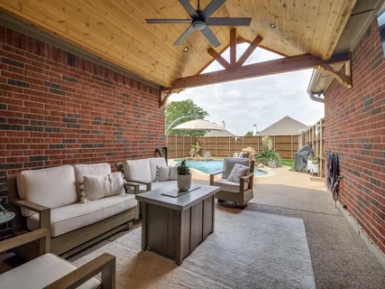 a patio with patio couch and table
