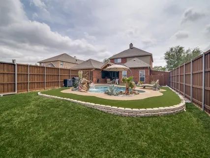 a view of a house with a yard porch and sitting area
