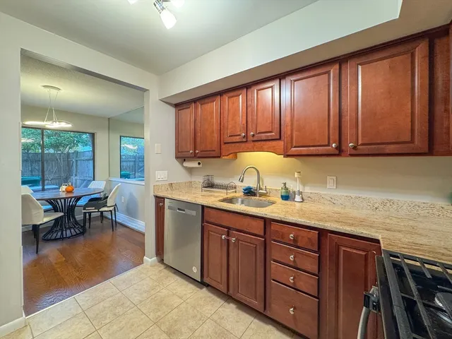 a kitchen with a sink cabinets and window