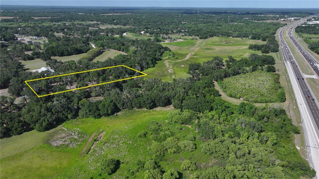 Muck Pond Road Seffner, FL 33584 - Photo 6 of 13 an aerial view of residential houses with outdoor space and trees