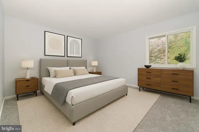 a bed room with a bed and a dresser