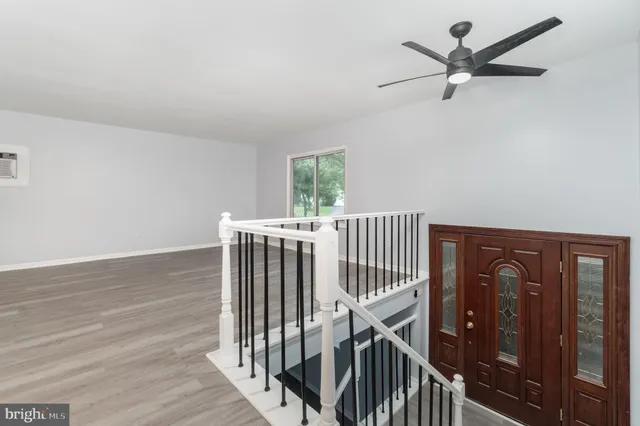 a view of entryway with wooden floor