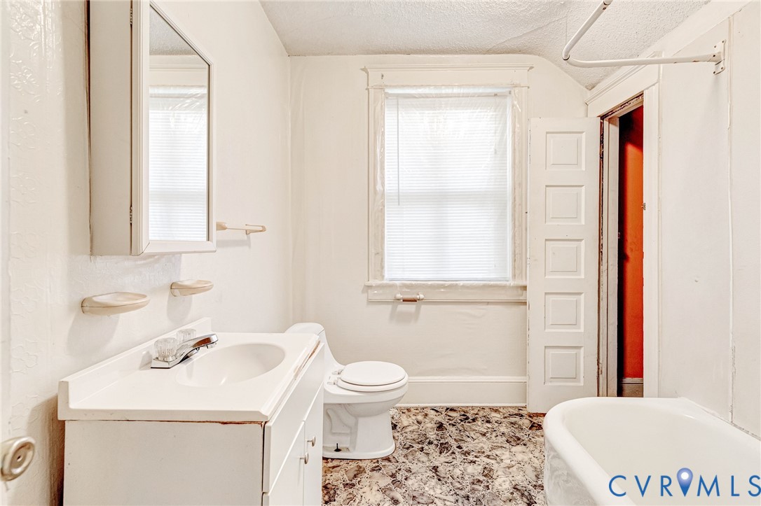 3301 Main Street Petersburg, VA 23803 - Photo 11 of 18 a bathroom with a sink a toilet and a window