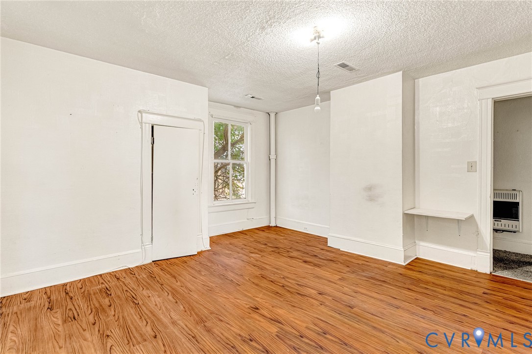 3301 Main Street Petersburg, VA 23803 - Photo 12 of 18 a bedroom with a bed and a flat screen tv
