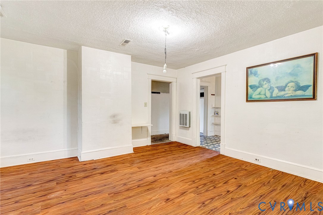 3301 Main Street Petersburg, VA 23803 - Photo 13 of 18 a bedroom with a bed and a painting on the wall