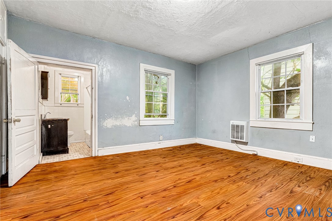 3301 Main Street Petersburg, VA 23803 - Photo 7 of 18 a view of empty room with wooden floor and fan