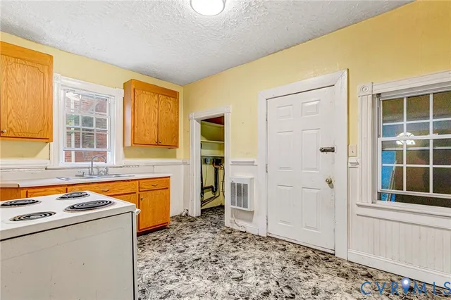 a room with a stove and a window